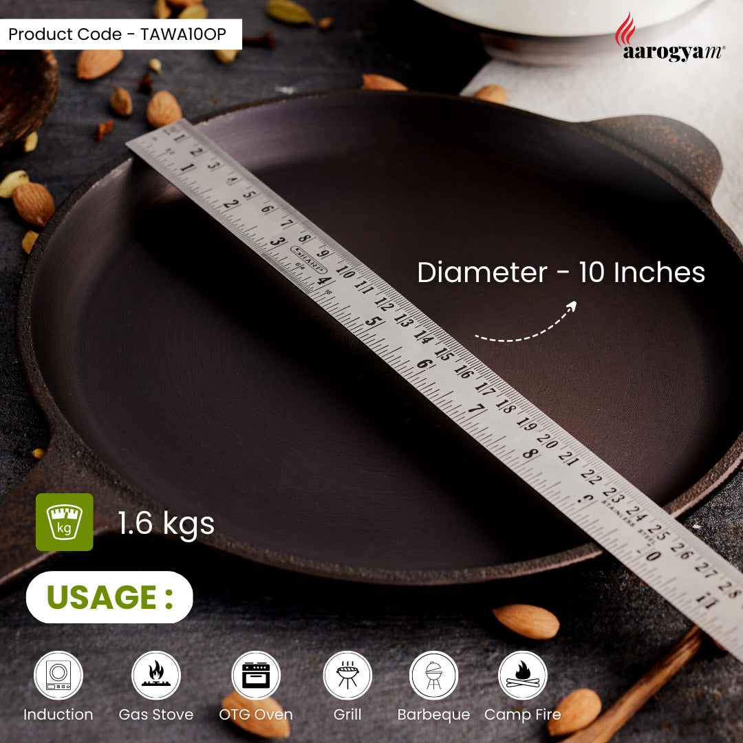 Cast iron pan with a ruler showing its diameter, surrounded by nuts on a dark surface.