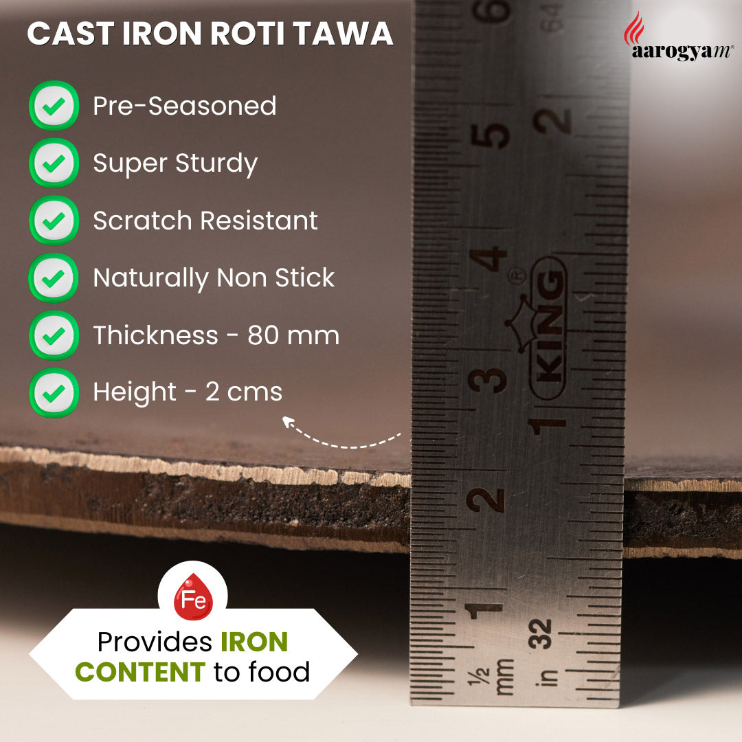 Cast iron roti tawa with measurement details and a ruler for scale.