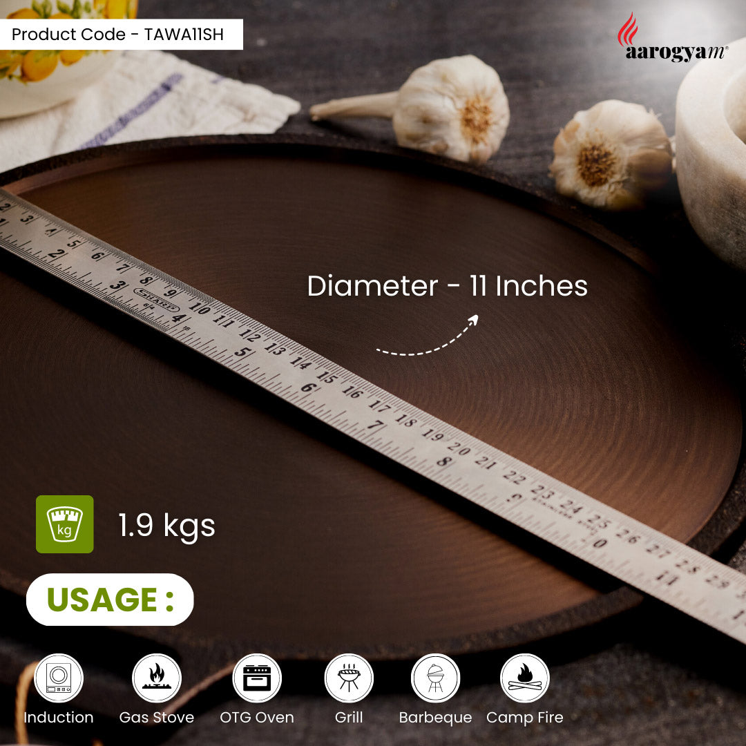 Wooden tray with a ruler showing its diameter, placed on a surface with flowers and kitchen items.