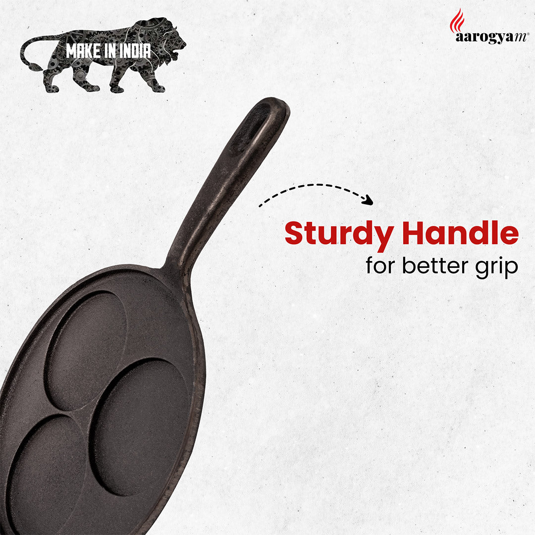 Cast iron pan with a sturdy handle on a white background, featuring 'Make in India' and 'aarogyaTV' logos.